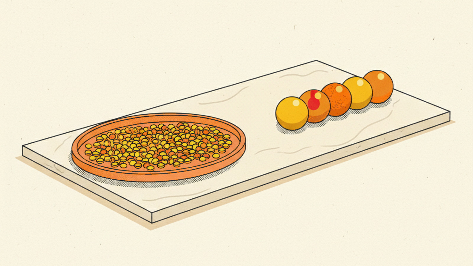 A round terracotta tray of many small amber beads beside a short row of five larger yellow and orange spheres, one with a small red dot, on a pale-stone slab